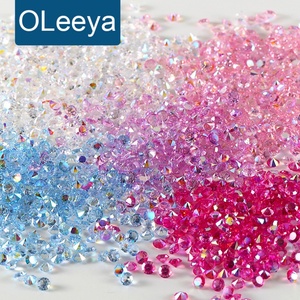 OLeeya Promotion Strass en résine en gros, Strass à dos pointu, Paillettes Pixie Dusts, Perles de cristal, Strass personnalisés pour la décoration d'ongles - Product Image 1