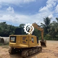 Excavatrice compacte sur chenilles d'occasion CAT 310 avec moteur puissant et performances hydrauliques fluides