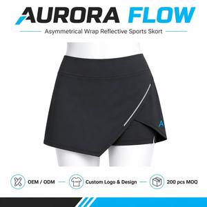<span class=keywords><strong>Falda</strong></span> pantalón deportiva asimétrica para mujer, diseño OEM/ODM personalizado, con ribete reflectante, pantalones cortos incorporados, cintura alta, secado rápido y elasticidad en 4 direcciones. - Product Image 1