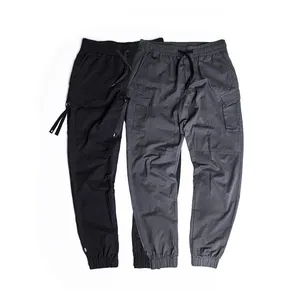 E OEM all'ingrosso mens tinta unita di colore solido jogging allenamento lungo pantaloni nastri cargo scarni sport pantaloni con tasche