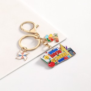 Porte-clés solaire en métal personnalisé et tendance, motif dessin animé, pour la Fête des Enseignants, avec crayon et carnet, idéal comme cadeau pour amis et pour sac à dos scolaire - Product Image 5