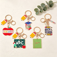 En gros Accessoires de rentrée scolaire pour étudiants et enfants : Breloque de sac et porte-clés en alliage avec pendentifs lettres, crayon, pomme