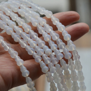 ลูกปัดหินอาเกตธรรมชาติทรงน้ำเต้า ขนาด 6x9 มม. สีขาว สำหรับทำเครื่องประดับ รูปทรงผสมผสาน สลักลาย ต้นกำเนิดจากจินหัว - Product Image 2