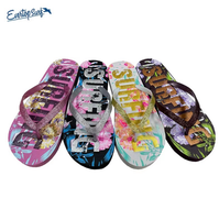 Vente en gros de tongs personnalisées à motif floral, avec sangle scintillante, en PE antidérapant, pour femmes, tongs de plage