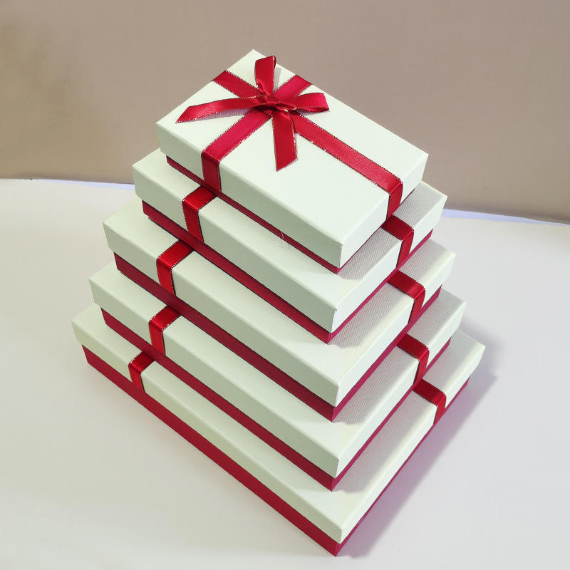 White box with red ribbon