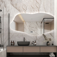 Miroir de salle de bain rétro-éclairé mural irrégulier avec capteur tactile anti-explosion et étanche à l'eau pour hôtel et maison