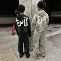 Ensemble de survêtement streetwear personnalisé pour homme, comprenant un sweat à capuche à rayures délavé à l'acide et un pantalon de survêtement droit, avec impression effet soleil délavé