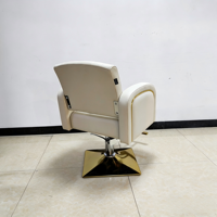 Fauteuil de coiffure hydraulique Ivoire avec base dorée et dossier cannelé – Mobilier de salon de coiffure en gros