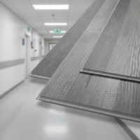 Plancher en vinyle stratifié SPC à clic flottant en PVC imperméable et antidérapant, design graphique pour hôpital, hôtel, école
