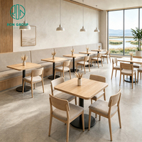 Chaise de restaurant commerciale Ron Group avec structure en bois, table carrée, banquette en tissu moderne et luxueuse pour café