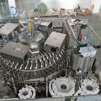 Automatique haute vitesse 10000bph bouteille en verre de 1 litre de vin vodka rinçage remplissage Ropp capsuleur T forme bouchant la machine