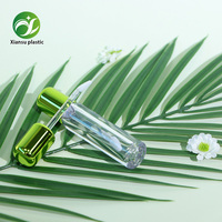 Tube vide en plastique transparent rond vert pour brillant à lèvres, contenant liquide cosmétique, matériau pour rouge à lèvres en forme d'enveloppe
