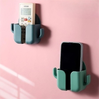 Boîte de rangement murale multifonctionnelle en plastique pour le chargement des téléphones portables Étagère pour télécommandes de téléphones portables Support pour petits objets