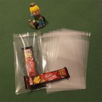 Sacs en plastique transparents autocollants écologiques en cellophane PE BOPP pour emballage de vêtements avec logo T-shirt