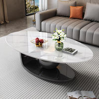 Table basse ovale moderne avec plateau en pierre frittée, design italien de luxe, base géométrique artistique pour salon