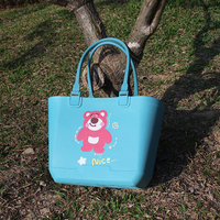 Nouveau cadeau à la mode mignon adapté petite fille sac à main en silicone avec double poignées et décoration en forme de fleur pour le voyage