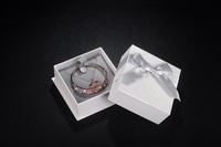 Boîtes à bijoux en carton Offre Spéciale en gros Boîte à bagues d'emballage de bijoux en ruban avec logo imprimé
