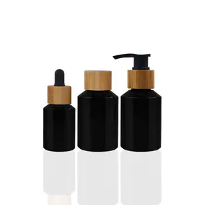 Cosmetic glass bottles packaging series slant shoulder clear black glass bottle and jar with bamboo lid products