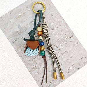 Breloque de <span class=keywords><strong>sac</strong></span> vintage de luxe en <span class=keywords><strong>cuir</strong></span> PU à motif floral, avec pompon et perles tressées, porte-clés, accessoire de mode pour <span class=keywords><strong>sac</strong></span> à main femme - Product Image 5