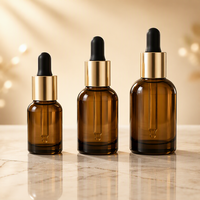 Flacon compte-gouttes en verre à base épaisse avec bouton poussoir 30ml 50ml, emballage de luxe pour sérum et huile essentielle avec boîte en papier