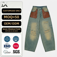 Jean Baggy Homme Vintage Délavé Effet Boue avec Patchwork Cuir et Détails Usés, Coupe Large, Denim Personnalisé 400g, 100% Coton Lourd