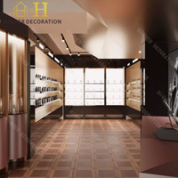 Vitrine de présentation de parfums de luxe en bois brun chaud haut de gamme pour l'agencement intérieur