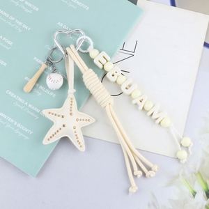 Creative DIY <b>Personalized</b> Starfish Tassel Letter Bead Leather <b>Keychain</b> Black and White Dual Color Car Bag Pendant - Product Image 4