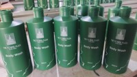 Distributeur mural de savon shampoing après-shampooing en plastique ABS de style moderne pour salle de bain pour hôtel en blanc vert orange