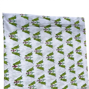 Premium pure cotton bird print fabric features <b>quirky</b> green parrot and flower motifs on a crisp white background this unique - Product Image 1