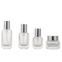 En stock : Ensemble de flacons cosmétiques en verre transparent avec pompe à lotion et pot à crème pour le visage, emballage estampé or pour les soins de la peau