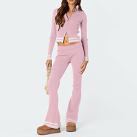 Ensemble coordonné zippé en maille pour femme avec broderie artisanale, coupe fluide et jambes larges, style survêtement raffiné