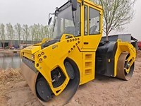 Rouleau compresseur vibrant à double tambour BOMAG BW203AD-4 d'occasion, 13 tonnes, pour asphalte