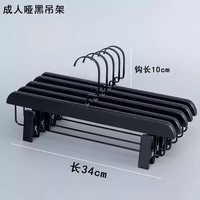 Collection de cintres en bois noir pour vêtements, cintres à épaules larges profilés pour costumes et cintres ajustables avec pinces pour pantalons et jupes, pour la vente au détail