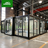 Unité de logement modulaire préfabriquée de 20 pieds et 40 pieds avec murs-rideaux en verre personnalisés, maison conteneur pliable, maison conteneur extensible