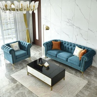 Canapé sectionnel Chesterfield en velours bleu avec pieds dorés et boutons