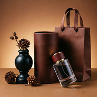 Flacon de parfum en verre cylindrique rond de luxe, personnalisable avec logo, 50 ml, rechargeable, avec vaporisateur, vente en gros OEM