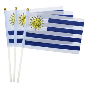 Venta al por mayor Fanáticos de los deportes 14*21cm Mini Uruguay Banner Bandera de mano con poste de plástico de 30cm