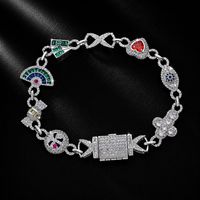 Bracelet Hip Hop multi-breloques en cuivre incrusté de zircone cubique, avec pendentifs cœur, bonbon et œil, chaîne style Iced Out Bling, bijoux unisexe, vente en gros