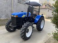 Tracteur à roues Shanghai Holland 804 d'occasion, 4x4, 80 CV, moteur diesel 4 cylindres, boîte de vitesses, cabine fermée, bleu noir, 2000 heures de travail