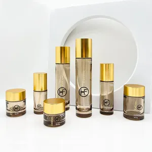 Amber Translucent Cosmetic Set Glass Bottle With Matte 14K Gold Lid With 1OZ 1.75OZ Pump Bottle