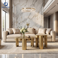 Table basse de luxe en acier inoxydable au design unique, soudée avec des cylindres métalliques, pour la décoration de villas et d'hôtels.
