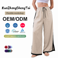 Pantalon décontracté avec cordon de serrage à la taille, rayures contrastées et ourlet fendu, confortable, polyvalent et personnalisable