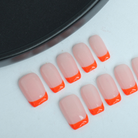 Uñas artificiales cortas de estilo francés naranja reutilizables de alta calidad, diseño fresco hecho a mano para aplicaciones en los dedos, venta al por mayor de fábrica
