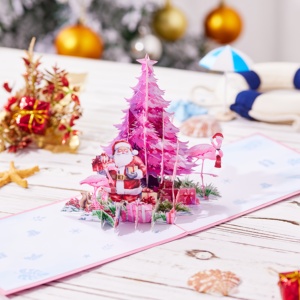 Tarjeta de Felicitación 3D Pop-up con Tema de Papá Noel y Flamencos, con un Lujoso y Fantástico Árbol de Navidad Rosa y una Pila de Regalos Rosados - Product Image 3