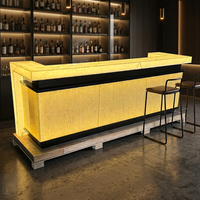 Comptoirs de caisse de bar de nuit illuminés par LED de luxe, en forme de U, comptoir de bar en Corian pour hôtel, cocktail, musique