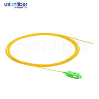 Fiber Optik Pigtail Simplex OS2 Single Mode G652D 0.9mm LSZH SC APC 1M dengan Buffer Ketat untuk FTTH, Pusat Data, POE, dan 5G