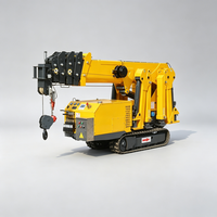 Mini-grue sur chenilles robuste et stable avec flèche articulée pour sites complexes