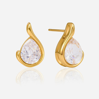 Boucles d'oreilles J&D Classic en acier inoxydable plaqué or 18 carats PVD, avec zircon cubique blanc et strass, modèle Fishhook Linear Wave Stud