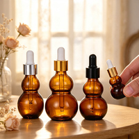 Bouteilles compte-gouttes en verre ambré en forme de gourde, résistantes à la lumière, pour le stockage d'huiles essentielles et l'utilisation cosmétique