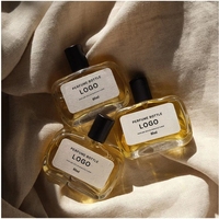 Buse de pompe à pression de 75ml Bouteille d'emballage cosmétique en verre transparent Bouteille de parfum à jet plat